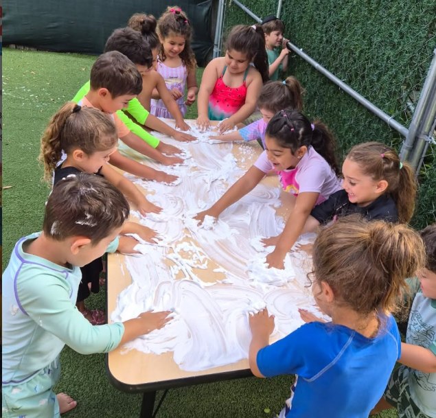 Children at a sensory play table